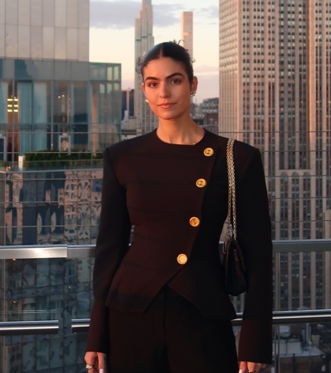 Portrait of Iara Saraiva on a rooftop at sunset